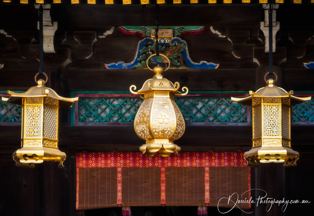 Poet's Festival Kitano Tenmangu Shrine in Kyoto Architectural roof details with golden lanterns